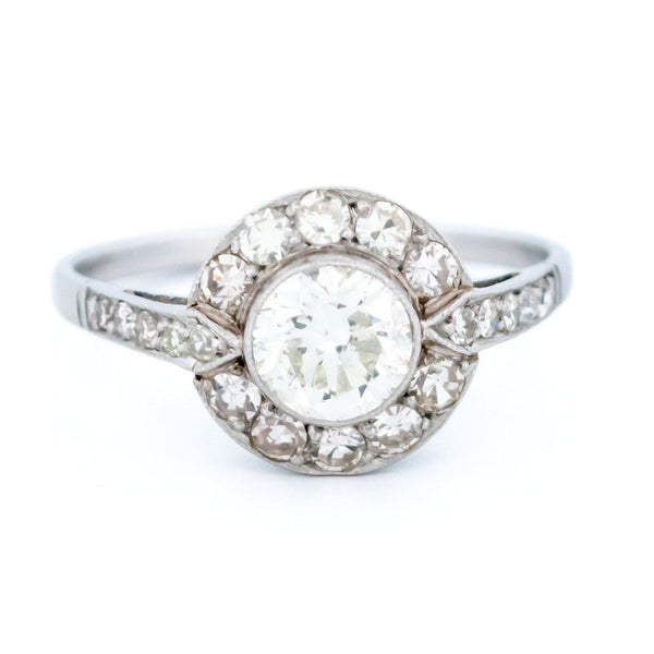A halo target cluster ring set with diamonds in platinum