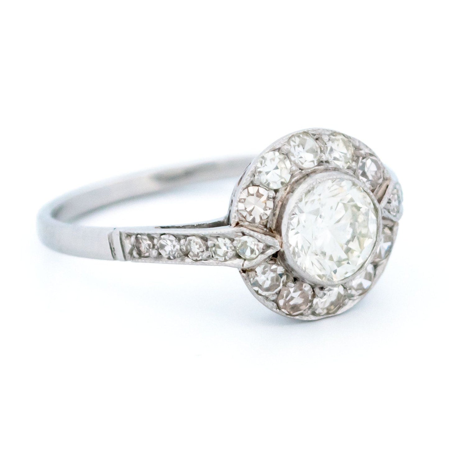 A halo target cluster ring set with diamonds in platinum