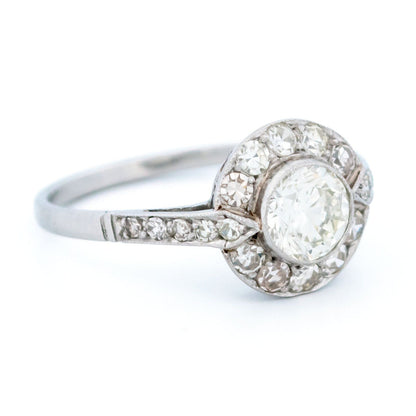 A halo target cluster ring set with diamonds in platinum