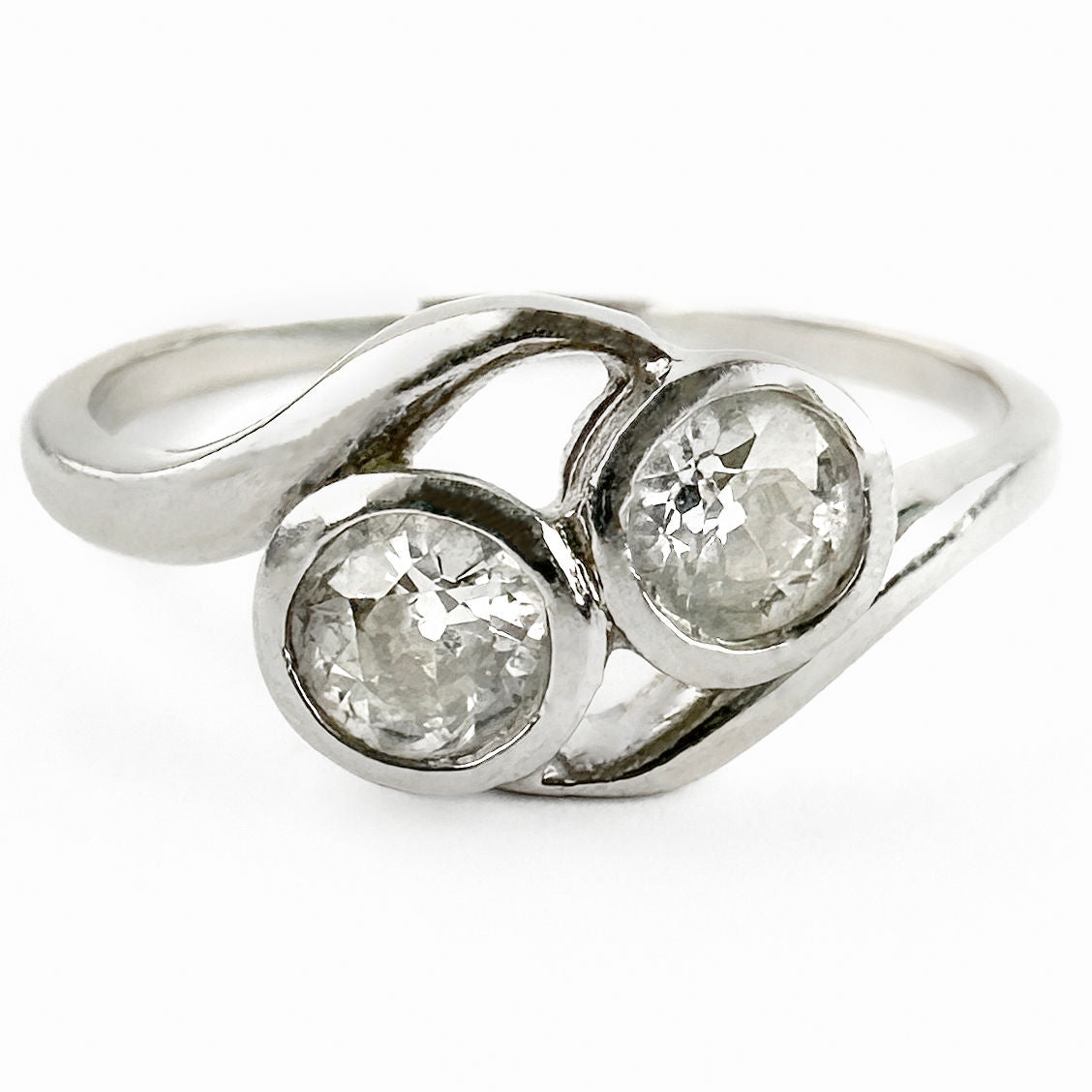 Edwardian Antique Diamond Toi et Moi Two Stone Crossover Engagement Ring in Platinum