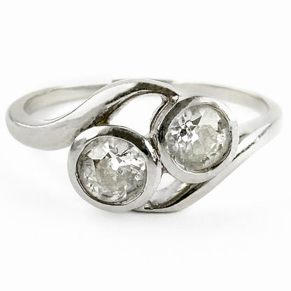 Edwardian Antique Diamond Toi et Moi Two Stone Crossover Engagement Ring in Platinum