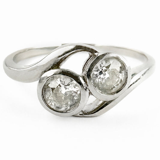 Edwardian Antique Diamond Toi et Moi Two Stone Crossover Engagement Ring in Platinum