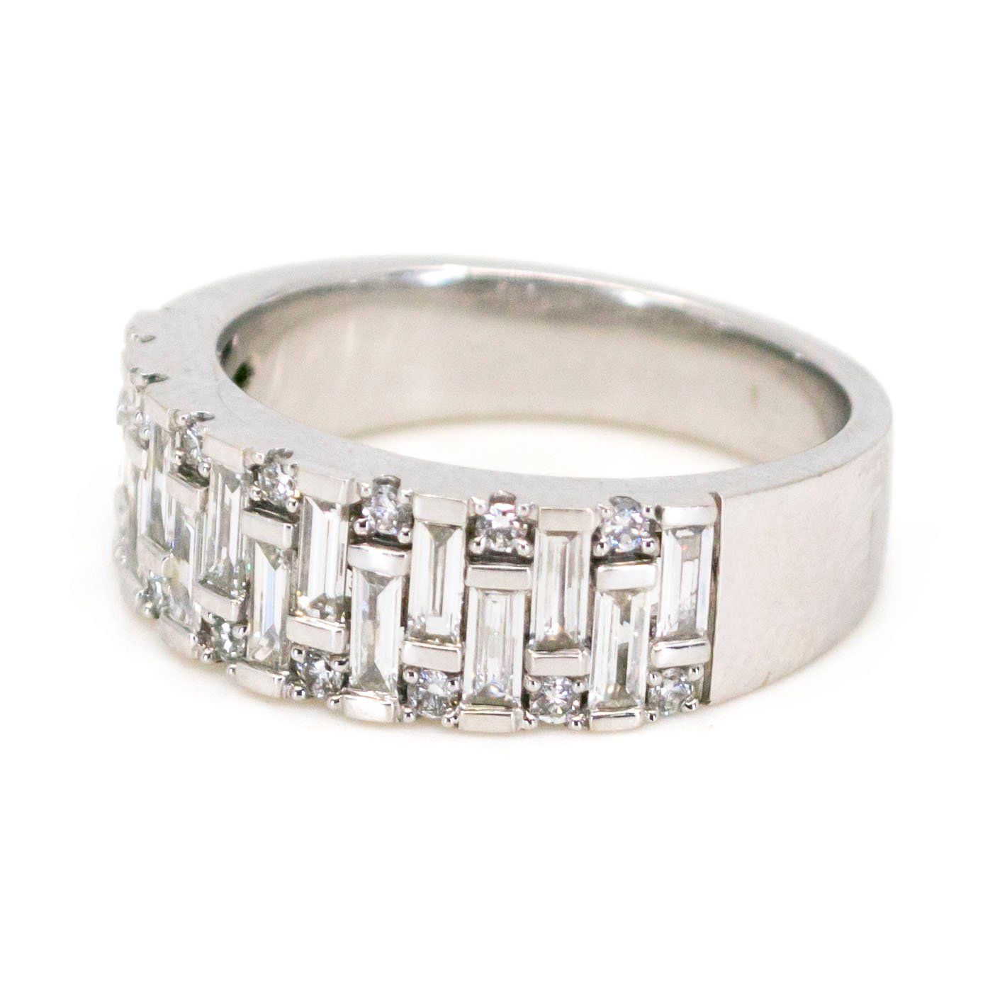 A baguette cut and brilliant cut diamond band ring in white gold