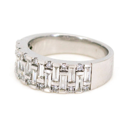 A baguette cut and brilliant cut diamond band ring in white gold