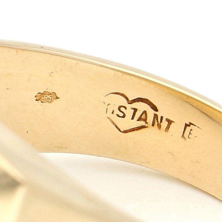 Close-up of a 585 stamp and maker's mark inside a yellow gold shank
