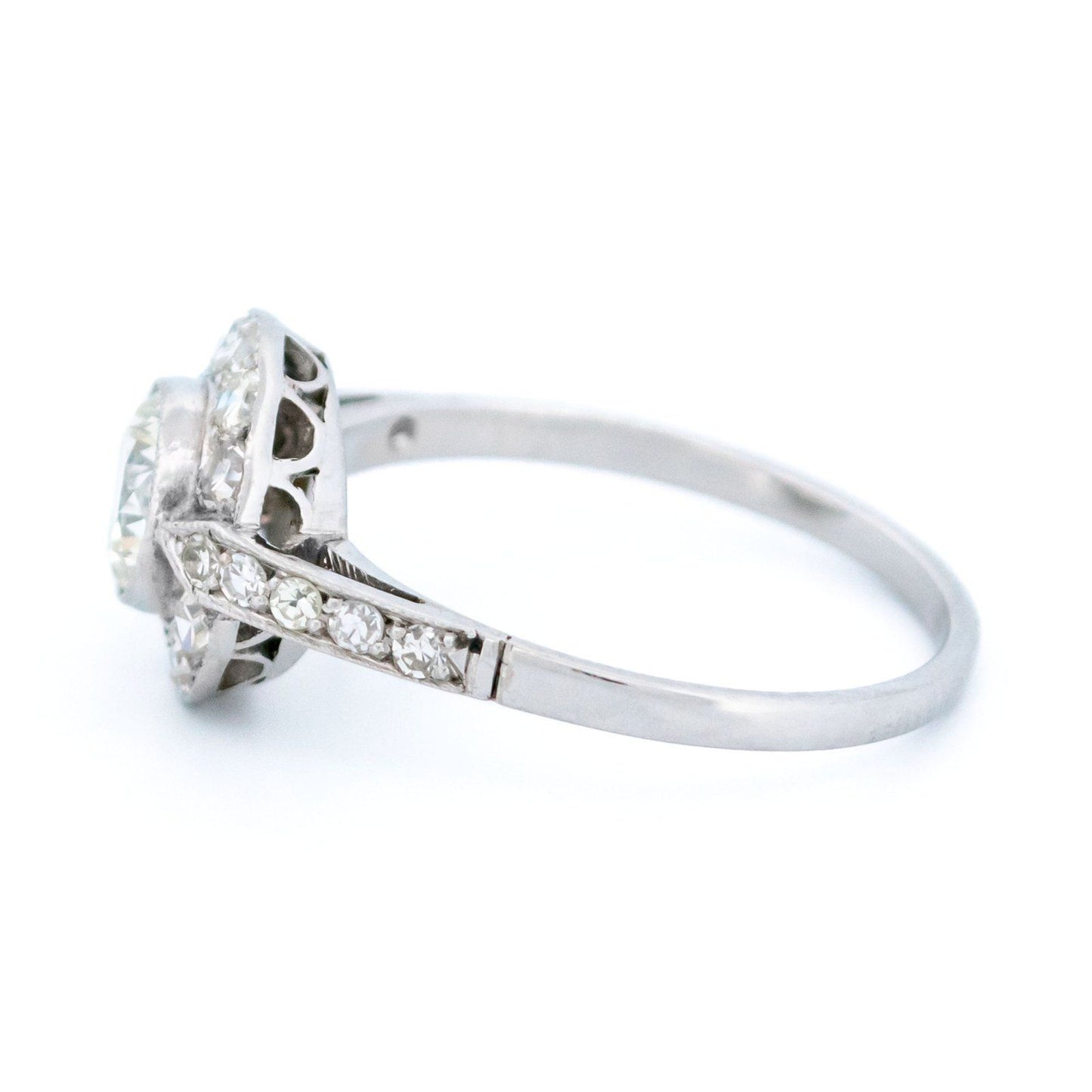A halo target cluster ring set with diamonds in platinum
