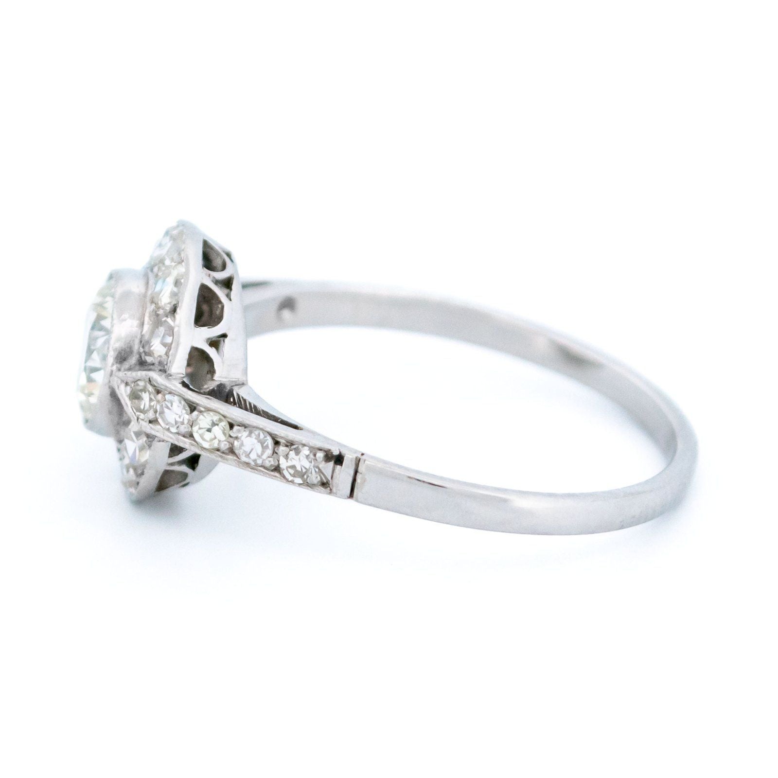 A halo target cluster ring set with diamonds in platinum