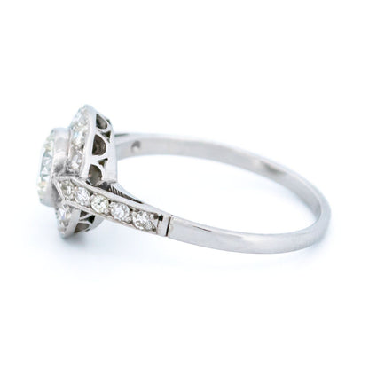 A halo target cluster ring set with diamonds in platinum