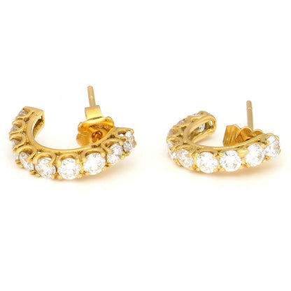 A pair of brilliant cut diamond half hoop earrings in yellow gold
