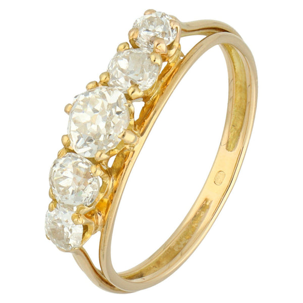 A graduated five stone diamond ring in yellow gold