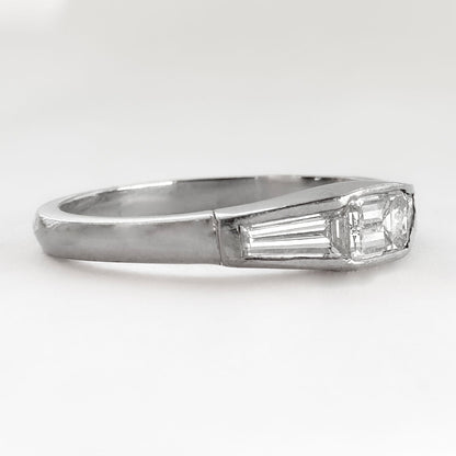 Vintage Emerald and Tapered Baguette Diamond Three Stone Engagement Ring in Platinum