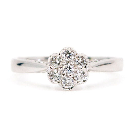 A white gold diamond daisy cluster ring