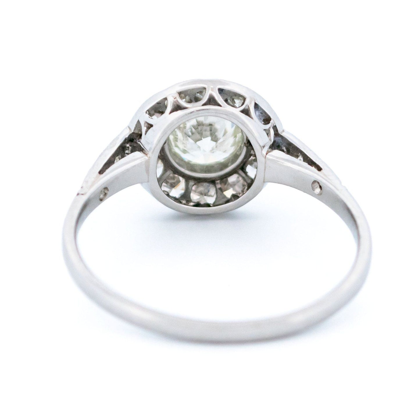 A halo target cluster ring set with diamonds in platinum