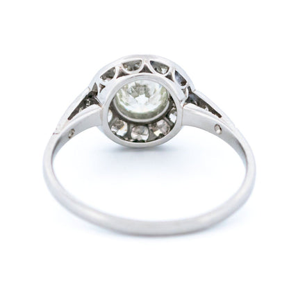 A halo target cluster ring set with diamonds in platinum