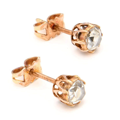 A yellow gold pair of solitaire rose cut diamond stud earrings