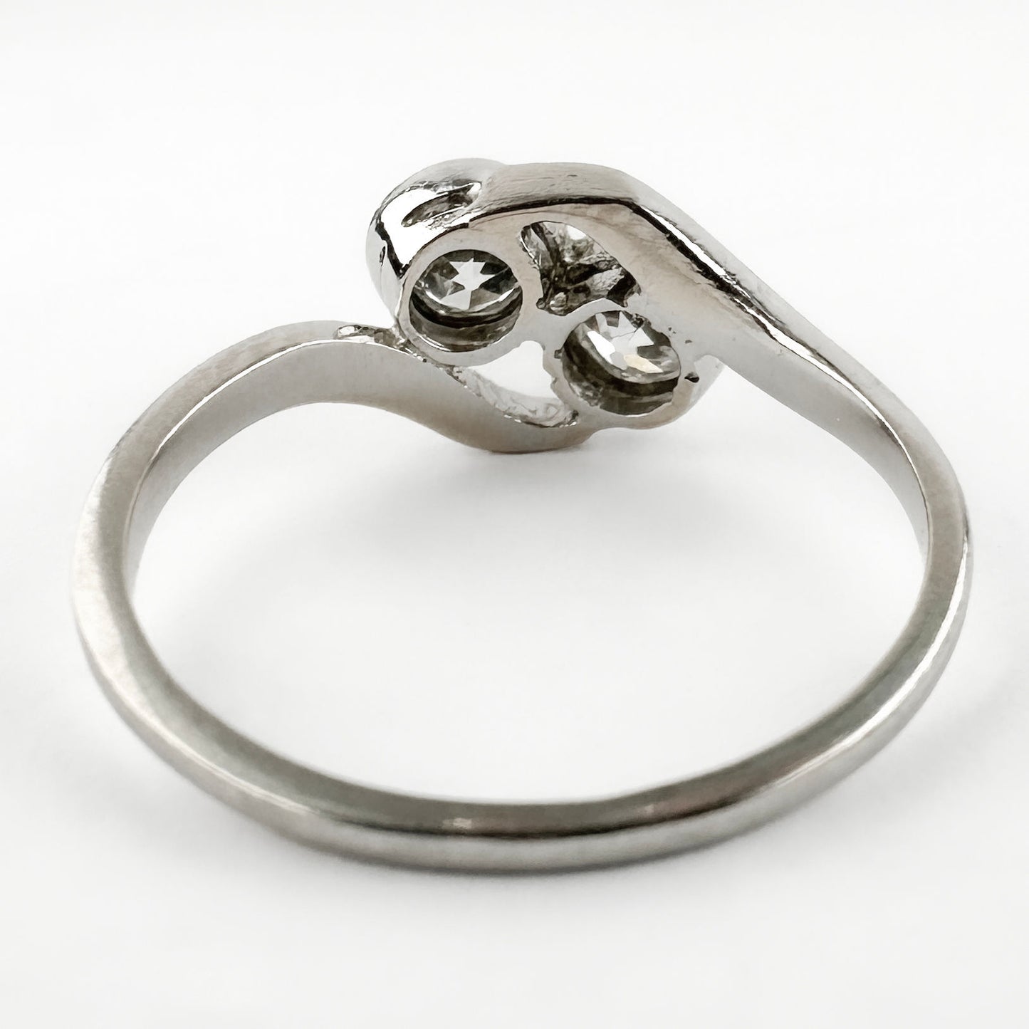 Edwardian Antique Diamond Toi et Moi Two Stone Crossover Engagement Ring in Platinum