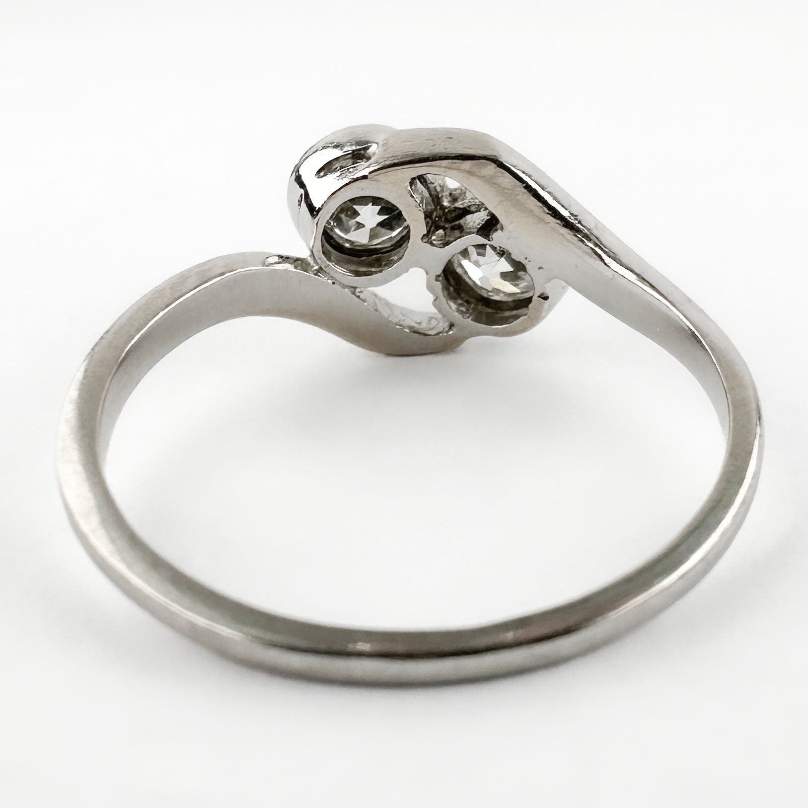 Edwardian Antique Diamond Toi et Moi Two Stone Crossover Engagement Ring in Platinum