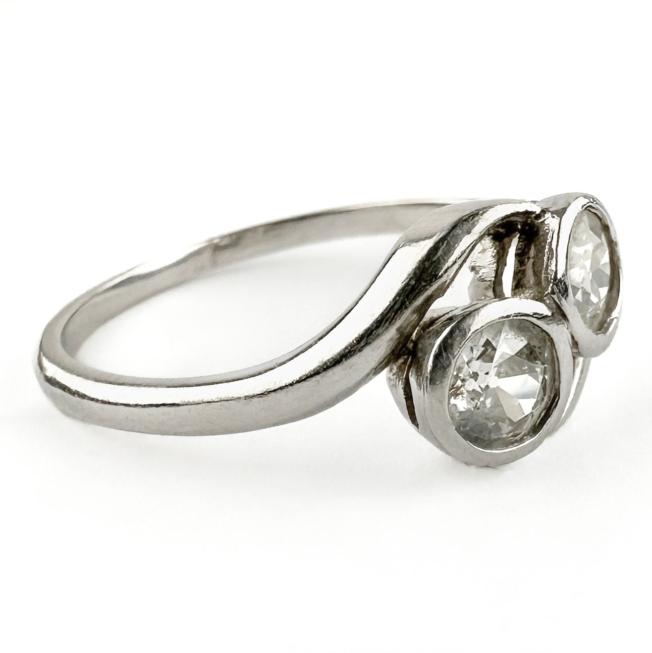 Edwardian Antique Diamond Toi et Moi Two Stone Crossover Engagement Ring in Platinum