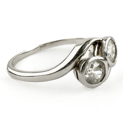 Edwardian Antique Diamond Toi et Moi Two Stone Crossover Engagement Ring in Platinum