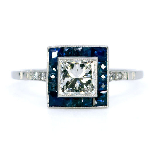A square shaped cluster ring with diamonds and sapphires in platinum