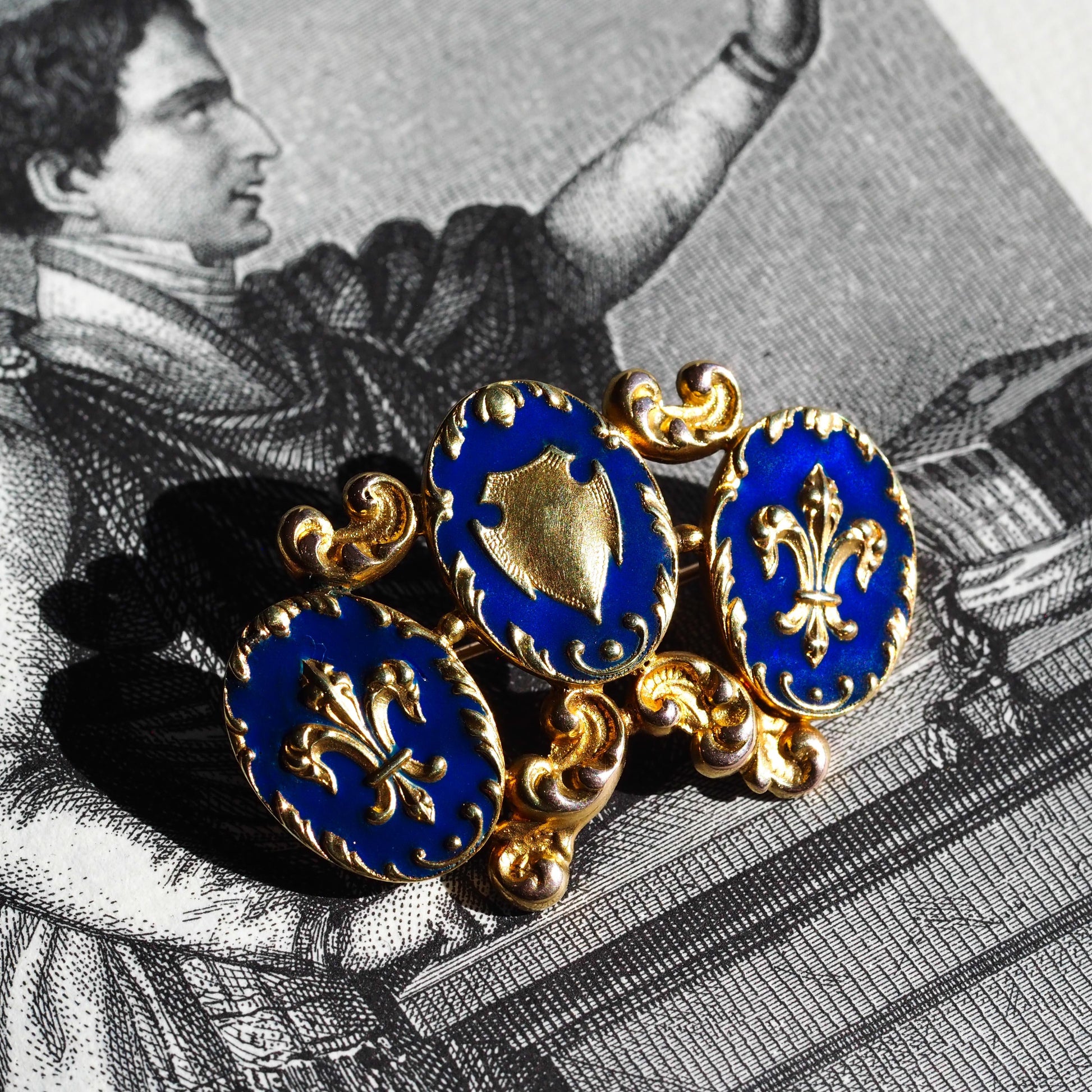 Antique Blue Enamel Fleur de Lys 18ct Gold Brooch in Triple Cartouche Design