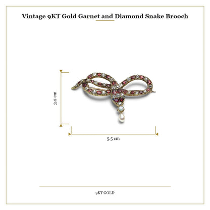 A yellow gold garnet, diamond and pearl set snake brooch, with measurements
