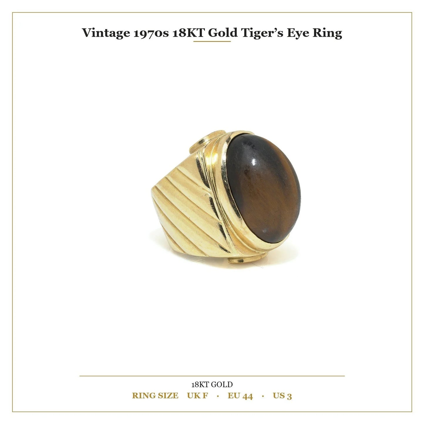 A yellow gold ring with an oval cabochon cut tiger's eye, with measurements