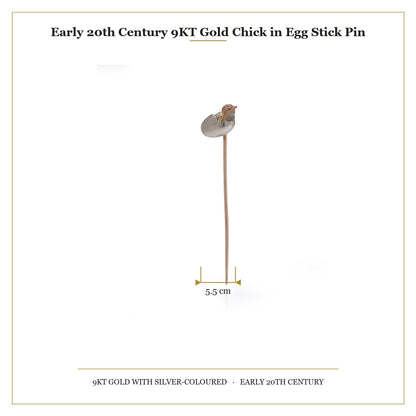 A stick pin depicting a chick hatching from an egg, in gold and silver, with measurements