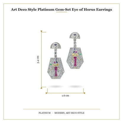 A pair of Eye of Horus drop earrings set with diamonds, rubies, emeralds, blue sapphires and yellow sapphires, in platinum, with measurements