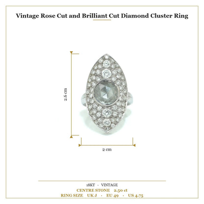 A marquise shaped diamond cluster ring with a central rose cut diamond, in white gold, with measurements