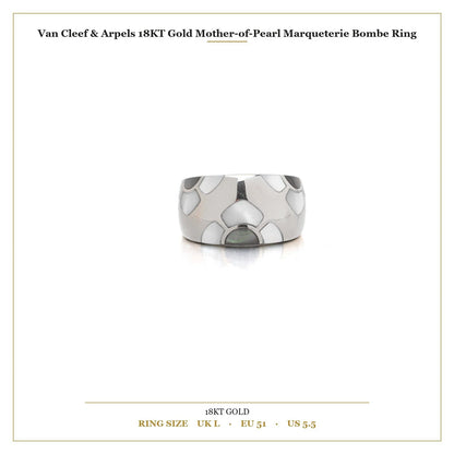 A white gold band ring with mother of pearl inlays, with measurements