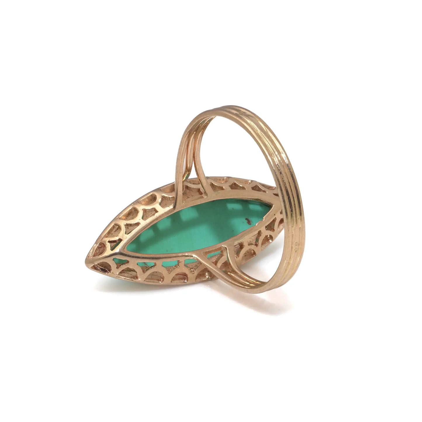 A navette shaped turquoise single stone ring in yellow gold