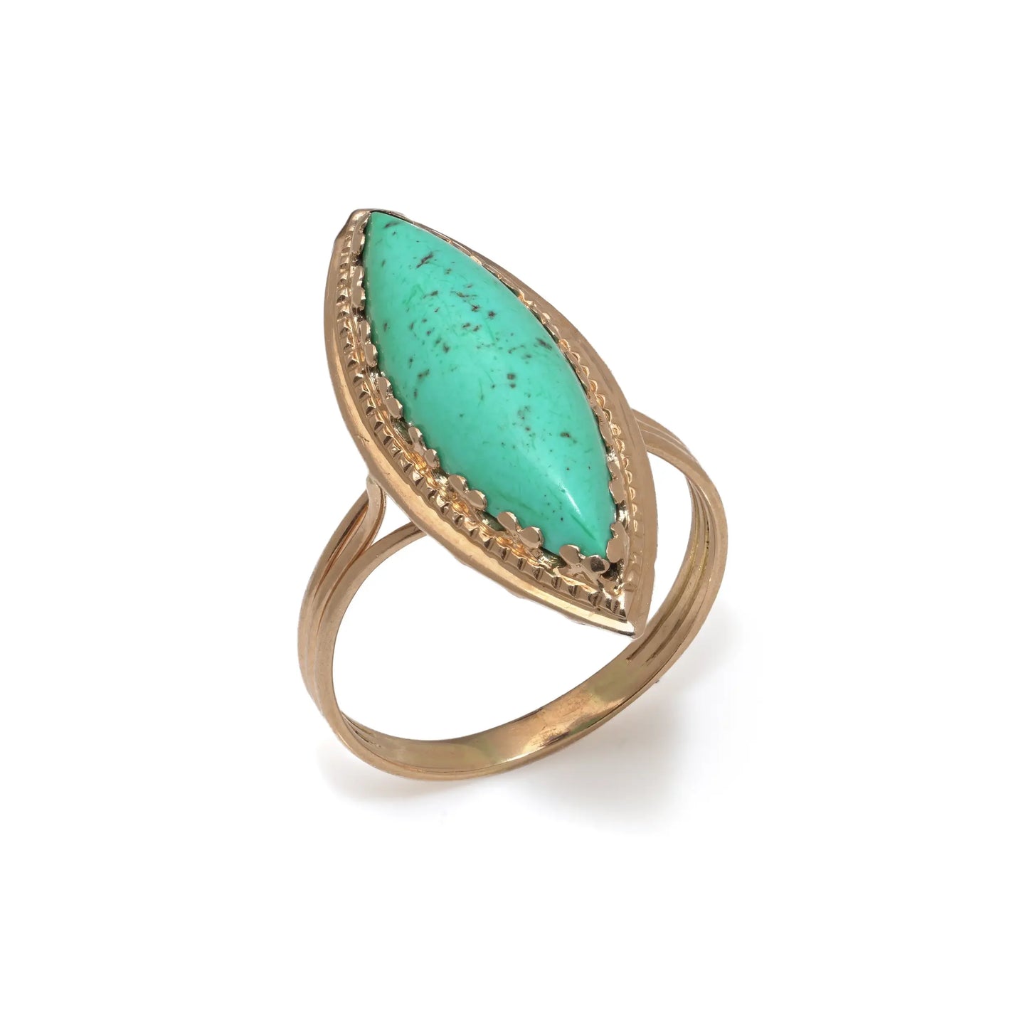 A navette shaped turquoise single stone ring in yellow gold