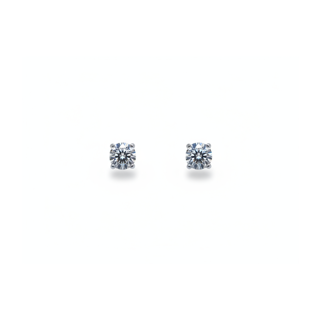 A pair of single stone round brilliant cut diamond stud earrings in white gold