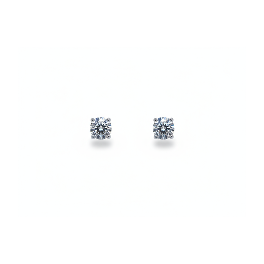 A pair of single stone round brilliant cut diamond stud earrings in white gold