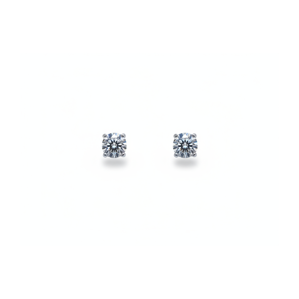 A pair of single stone round brilliant cut diamond stud earrings in white gold
