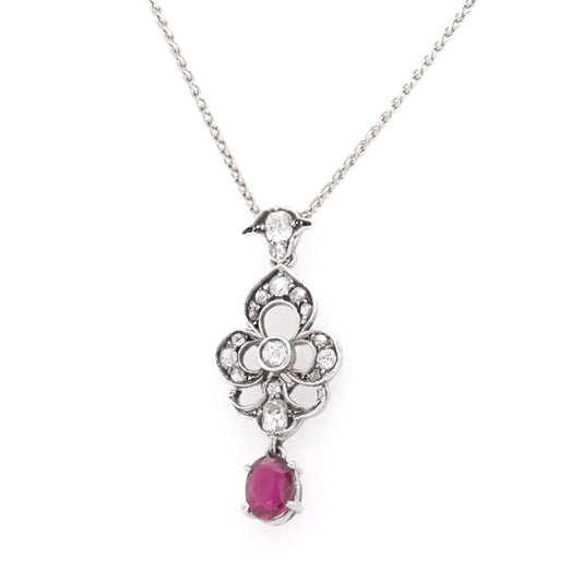 A ruby and diamond white gold pendant with chain