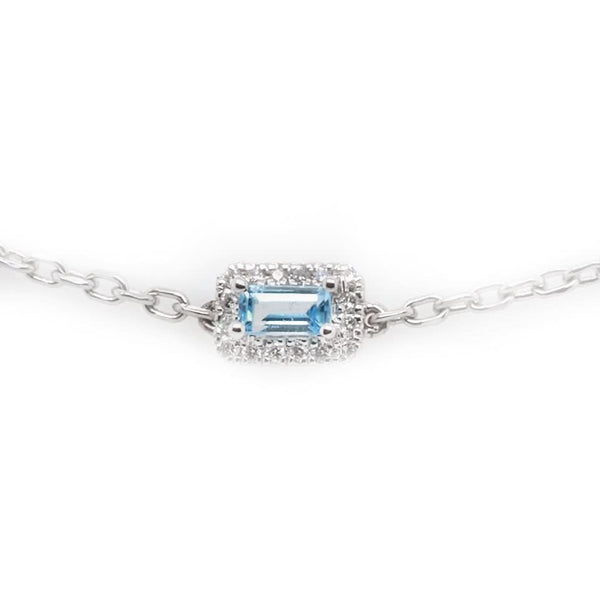 A white gold blue topaz and diamond cluster link bracelet