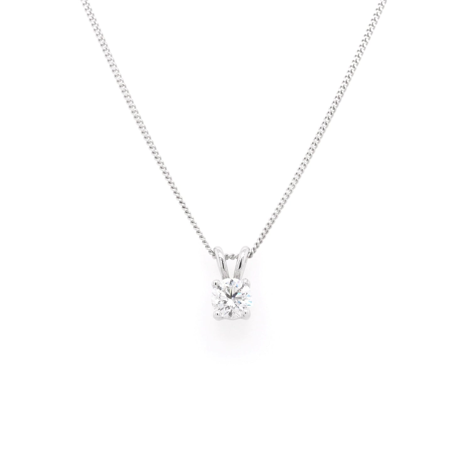 A single stone round brilliant cut diamond pendant in white gold, on a white gold curb chain
