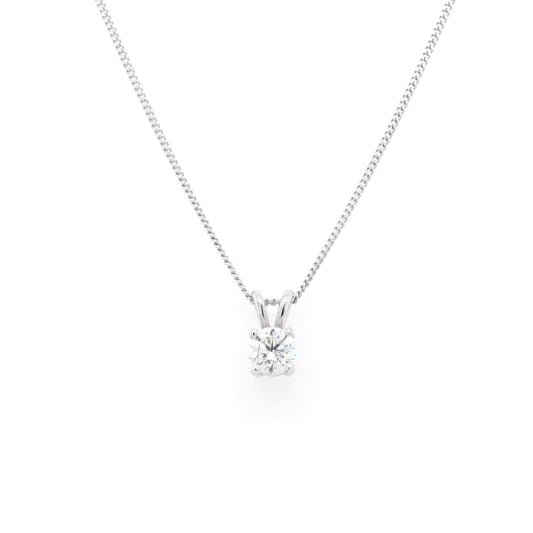 A single stone round brilliant cut diamond pendant in white gold, on a white gold curb chain
