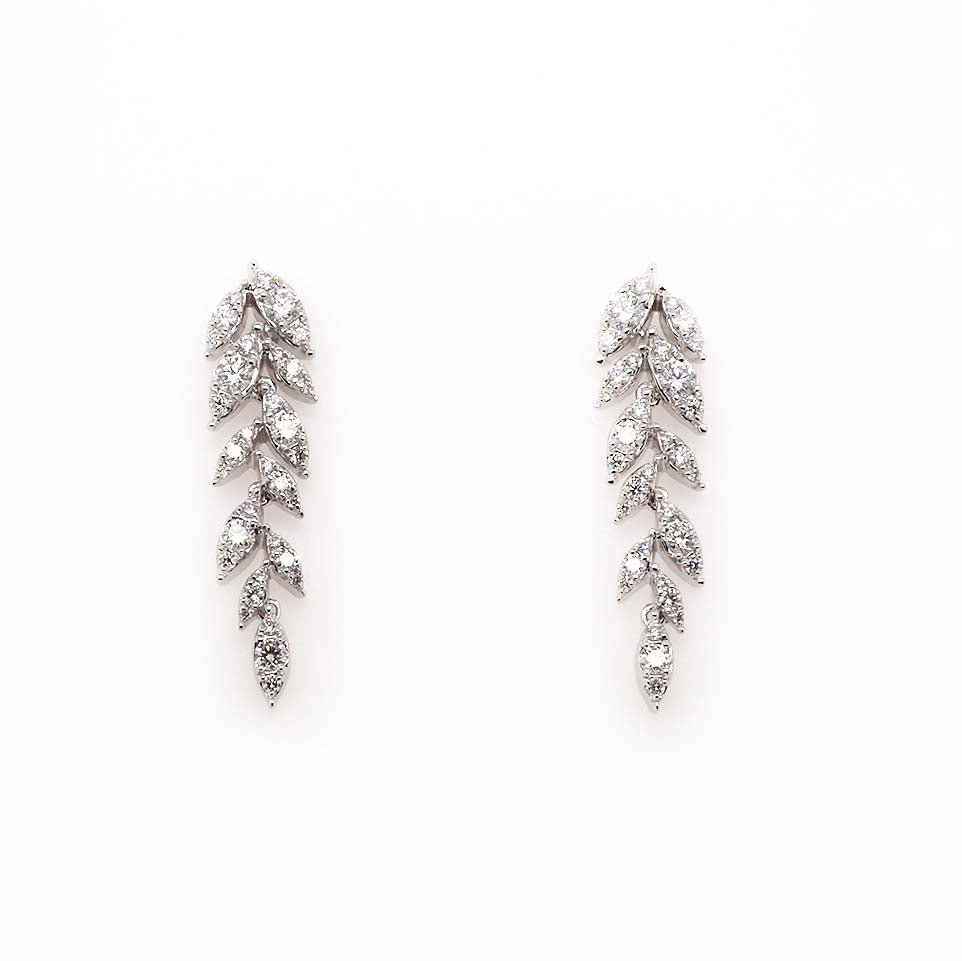 A pair of leaf shaped drop earrings in white gold, set with diamonds
