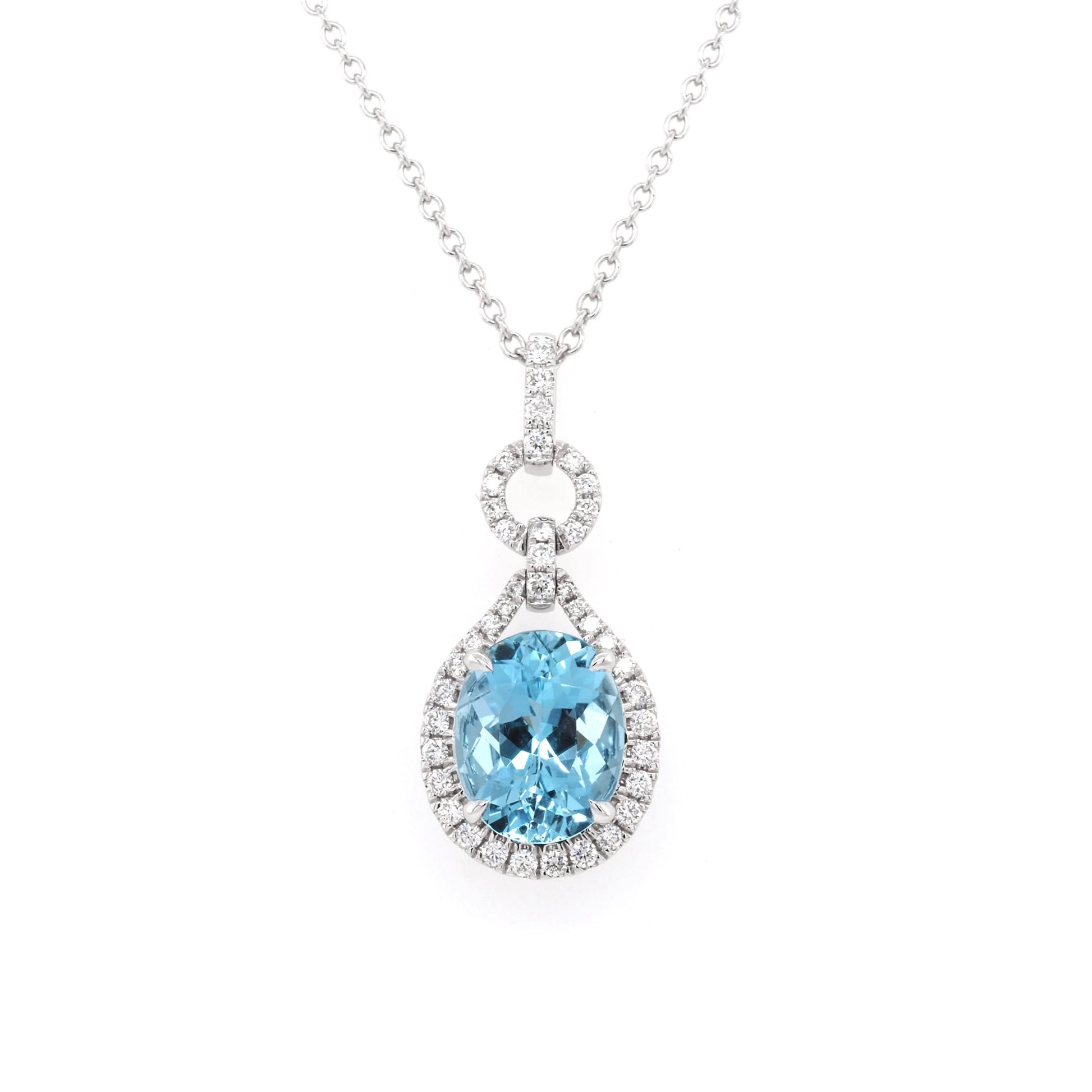 An aquamarine and diamond cluster drop pendant on a white gold chain