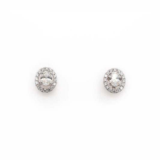 An oval pair of diamond earrings with removeable halo surrounds, in white gold