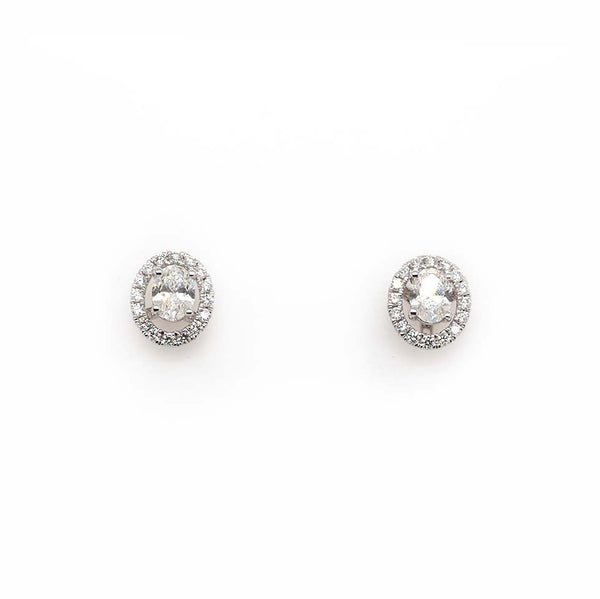 An oval pair of diamond earrings with removeable halo surrounds, in white gold