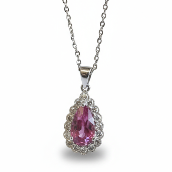 A pear shaped cluster pendant with a pear cut pink sapphire and a diamond surround in white gold, with a white gold chain