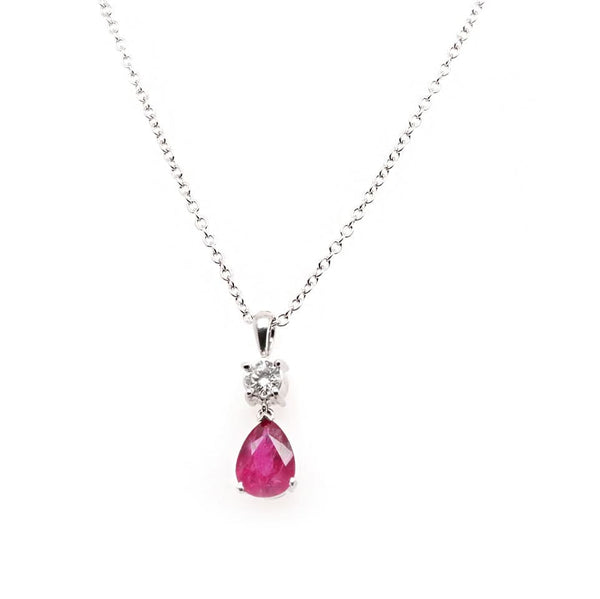 A pear shaped ruby and round brilliant cut diamond pendant in white gold, on a white gold chain
