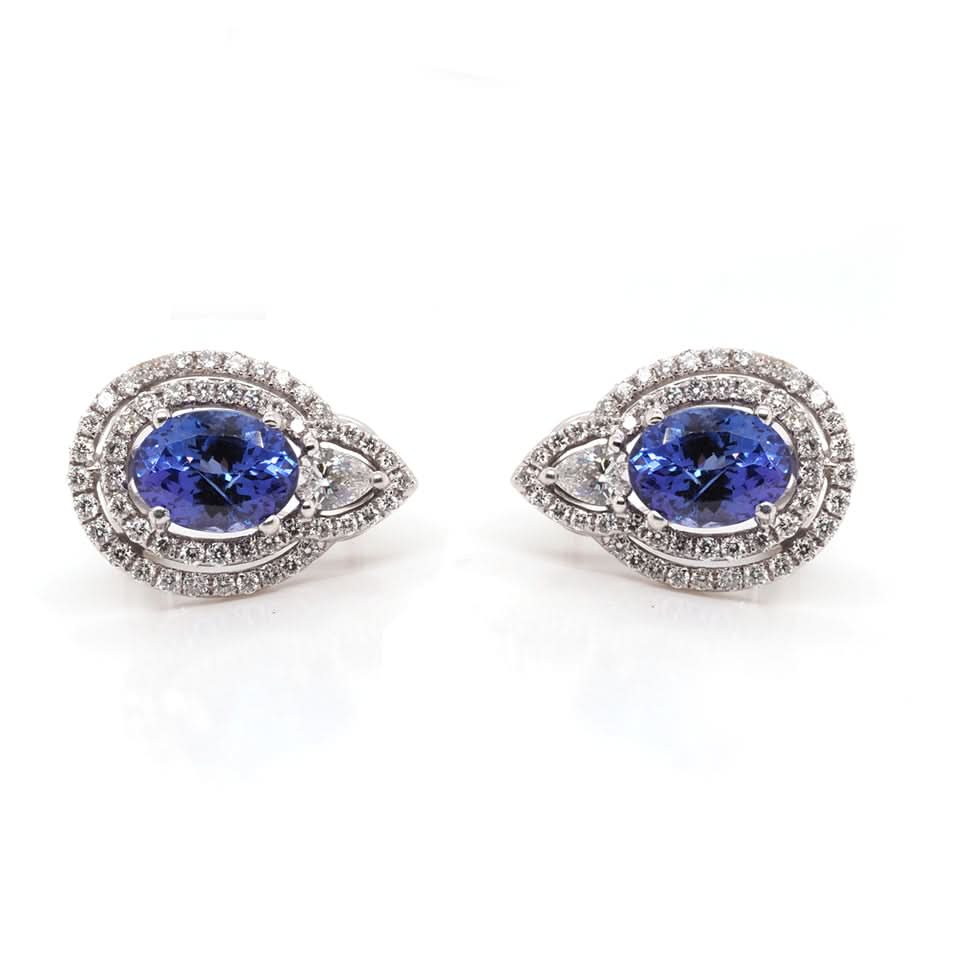 A pair of white gold tanzanite and diamond cluster stud earrings