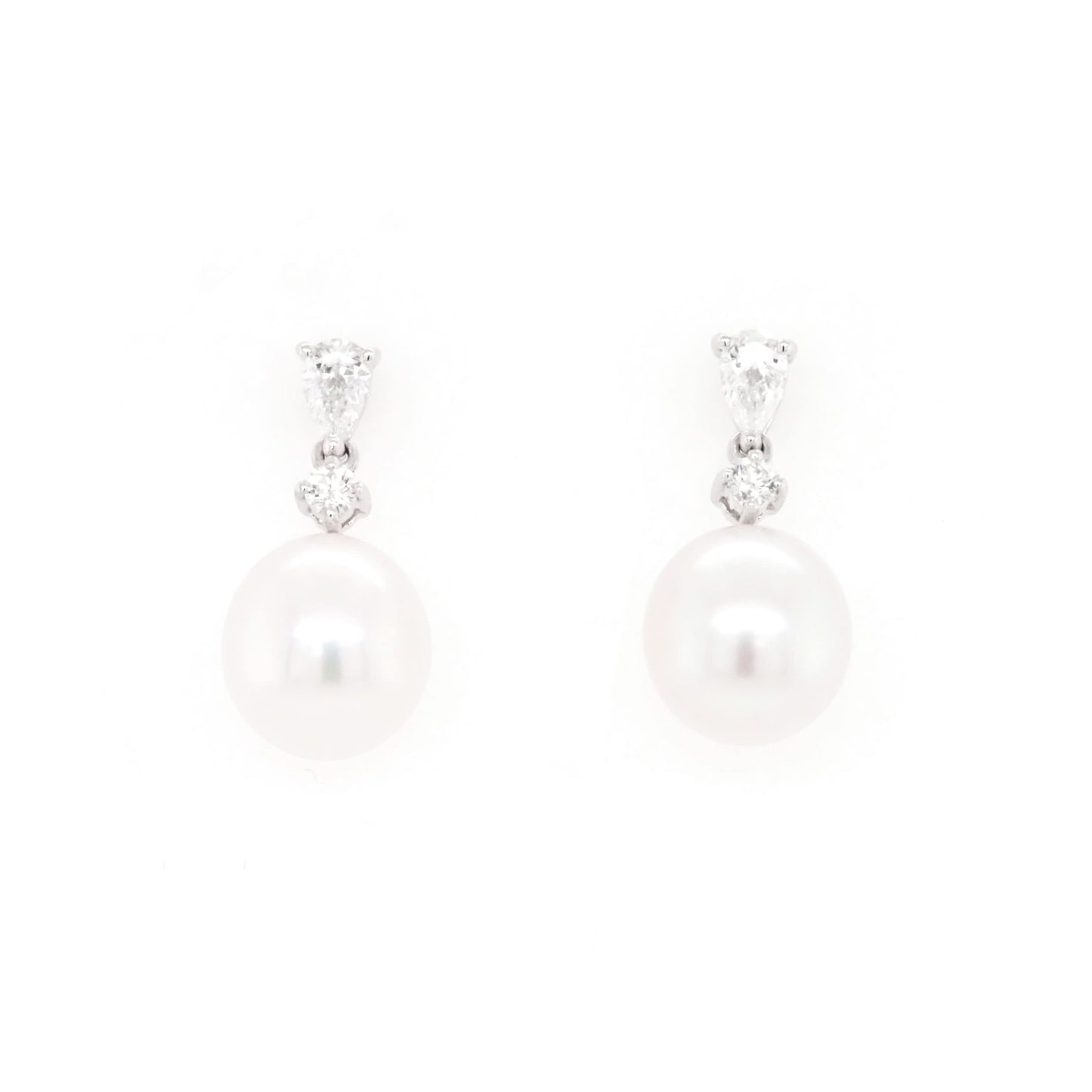 A pair of pearl and diamond drop earrings in white gold