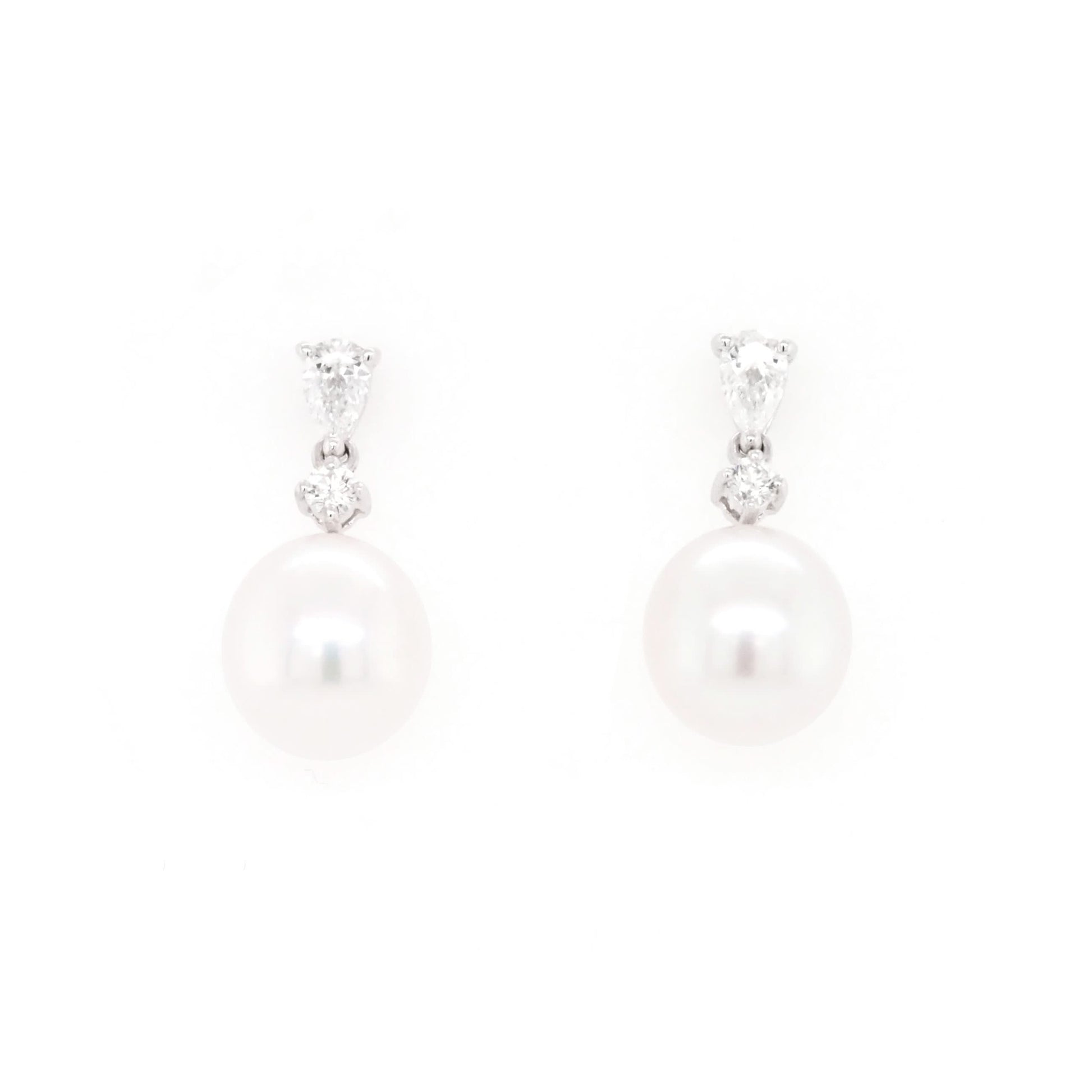 A pair of pearl and diamond drop earrings in white gold