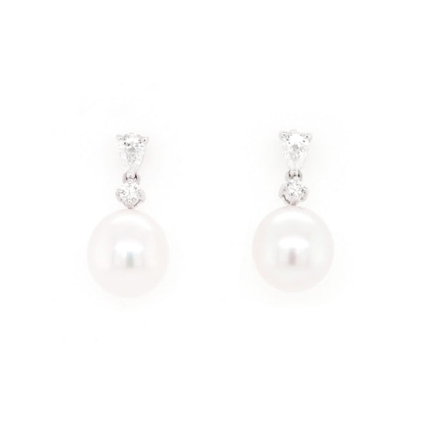 A pair of pearl and diamond drop earrings in white gold